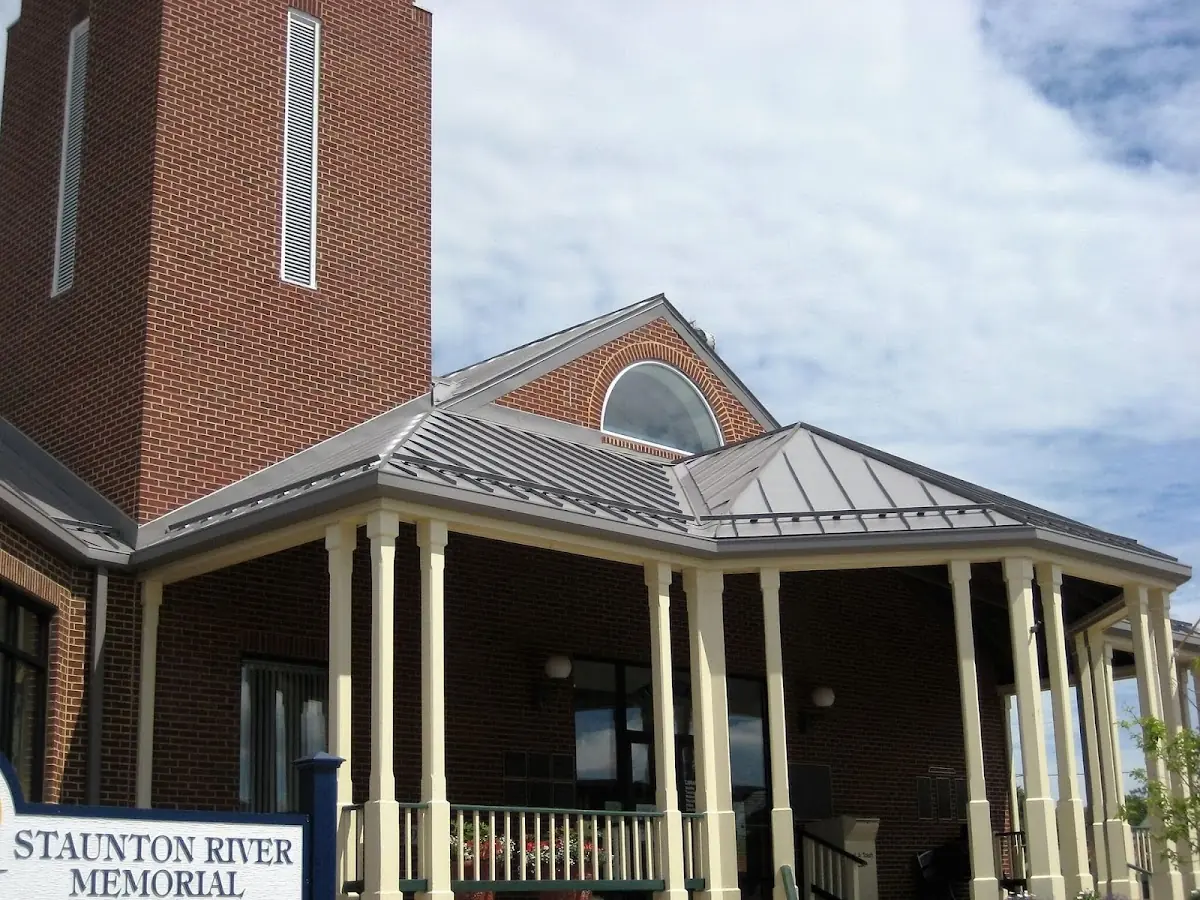 Skilled roofing craftsmen working on a residential roof in Weedsport